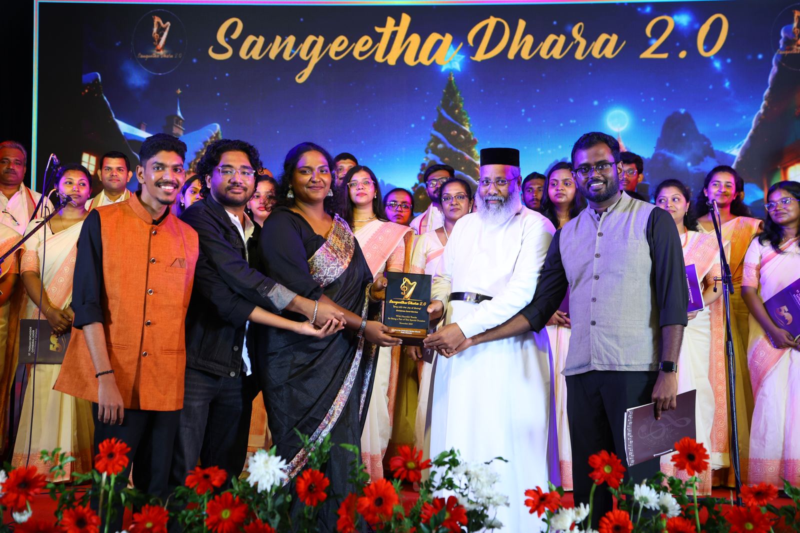 Organising team presenting a memento to clergy on stage